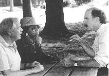 Photo of Mendelson talking with man and woman
